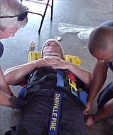 Immobilization Straps Being Placed on Person on Stretcher
