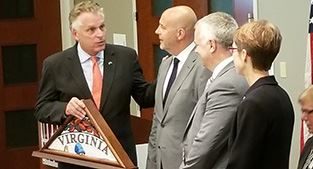 Governor Terry McAuliffe presents flag to Unison representatives