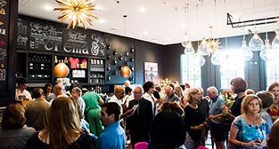 Citizens gather inside restaurant following grand opening