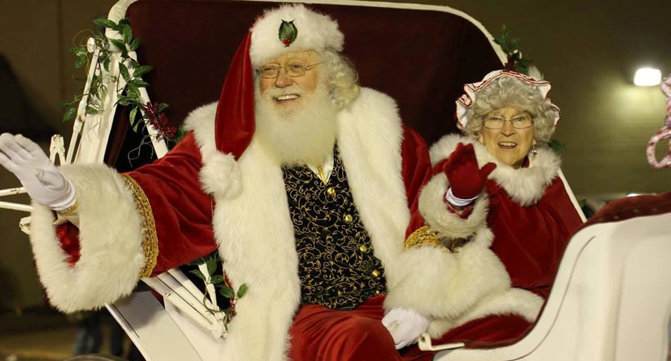 Santa and Mrs. Claus ride in Christmas parade