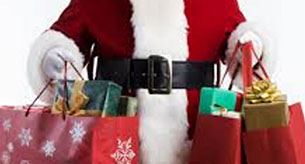 Holiday shopping - Santa holding gift bags