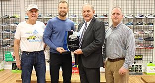 (Left to Right) Danville Running and Fitness Club President L.C. Moore, The Brick Running and Tri St
