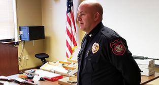 Police Chief Scott Booth speaking at news conference