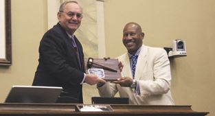 Mayor John Gilstrap, left, receives plaque of appreciation Tuesday.