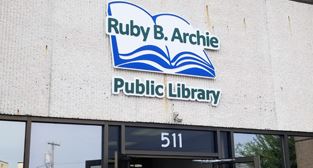 Ruby B. Archie Public Library sign outside building entrance