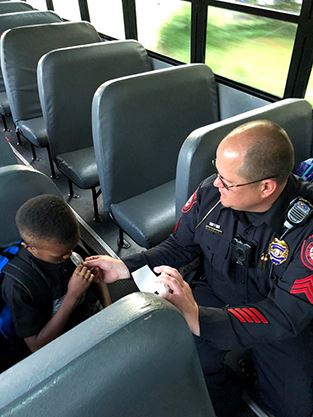 Police officer rides bus as part of 