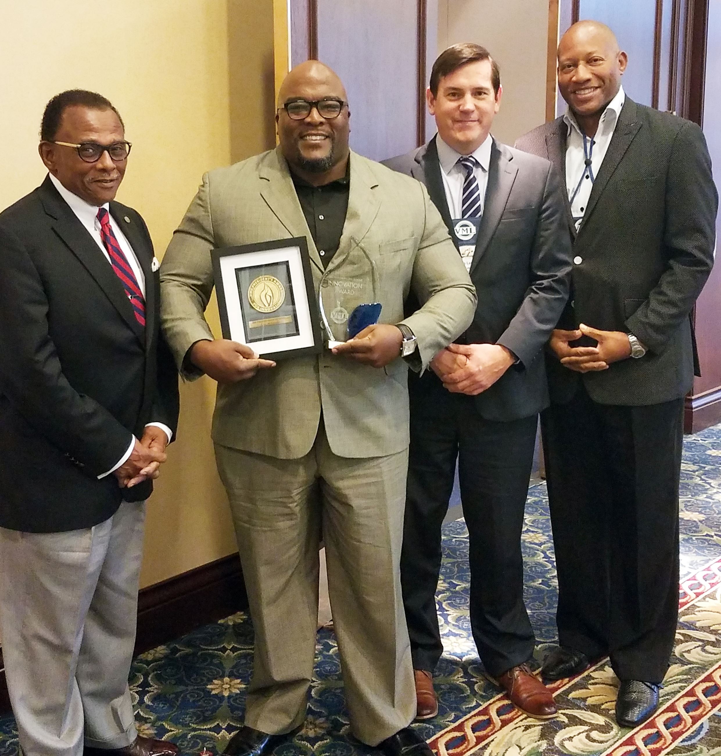 Robert David second from left, with Mayor Alonzo Jones, far right, City Manager Ken Larking, second 
