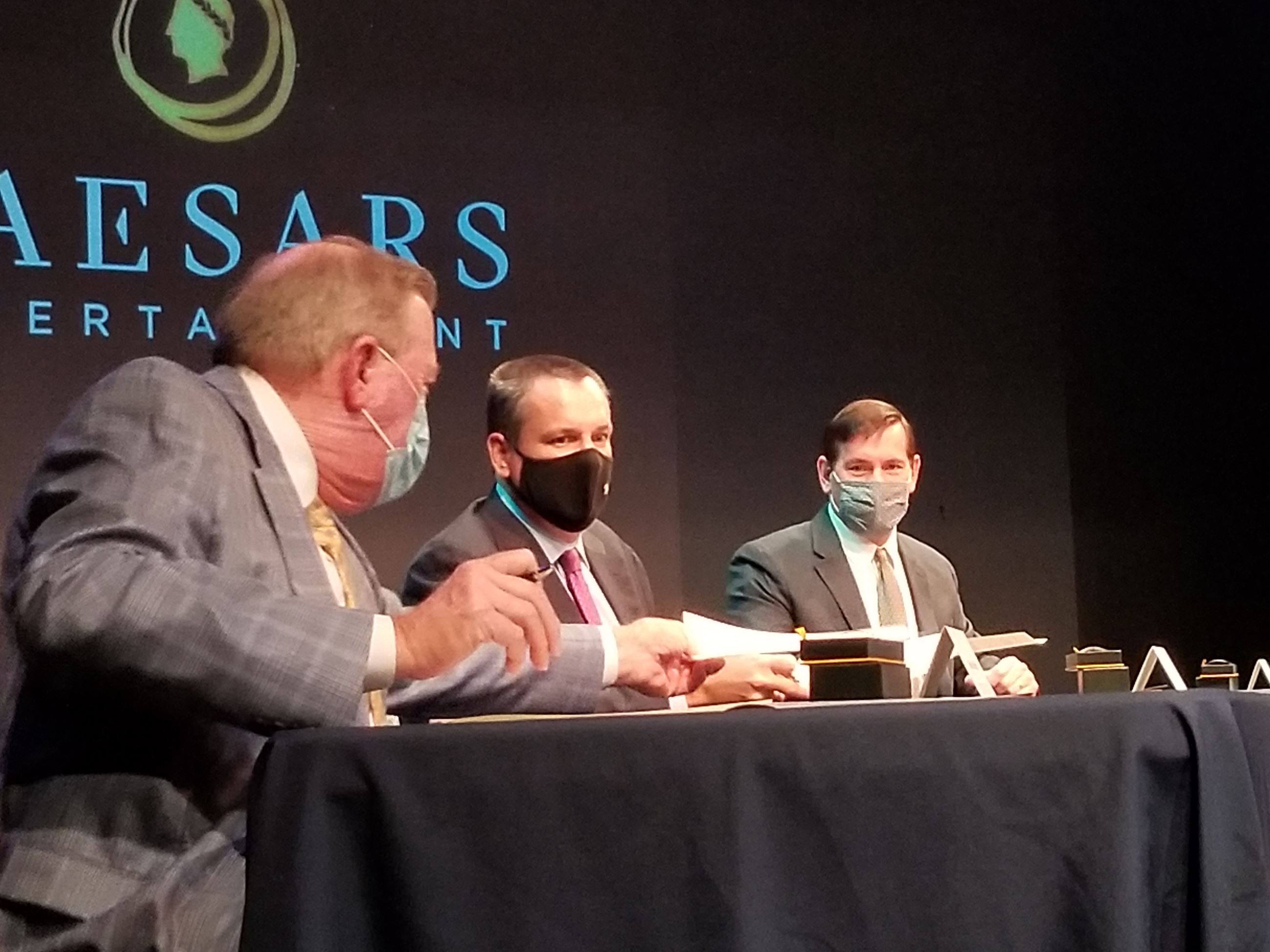 (Left to right) Neal Morris, Tom Reeg and Ken Larking sign agreement