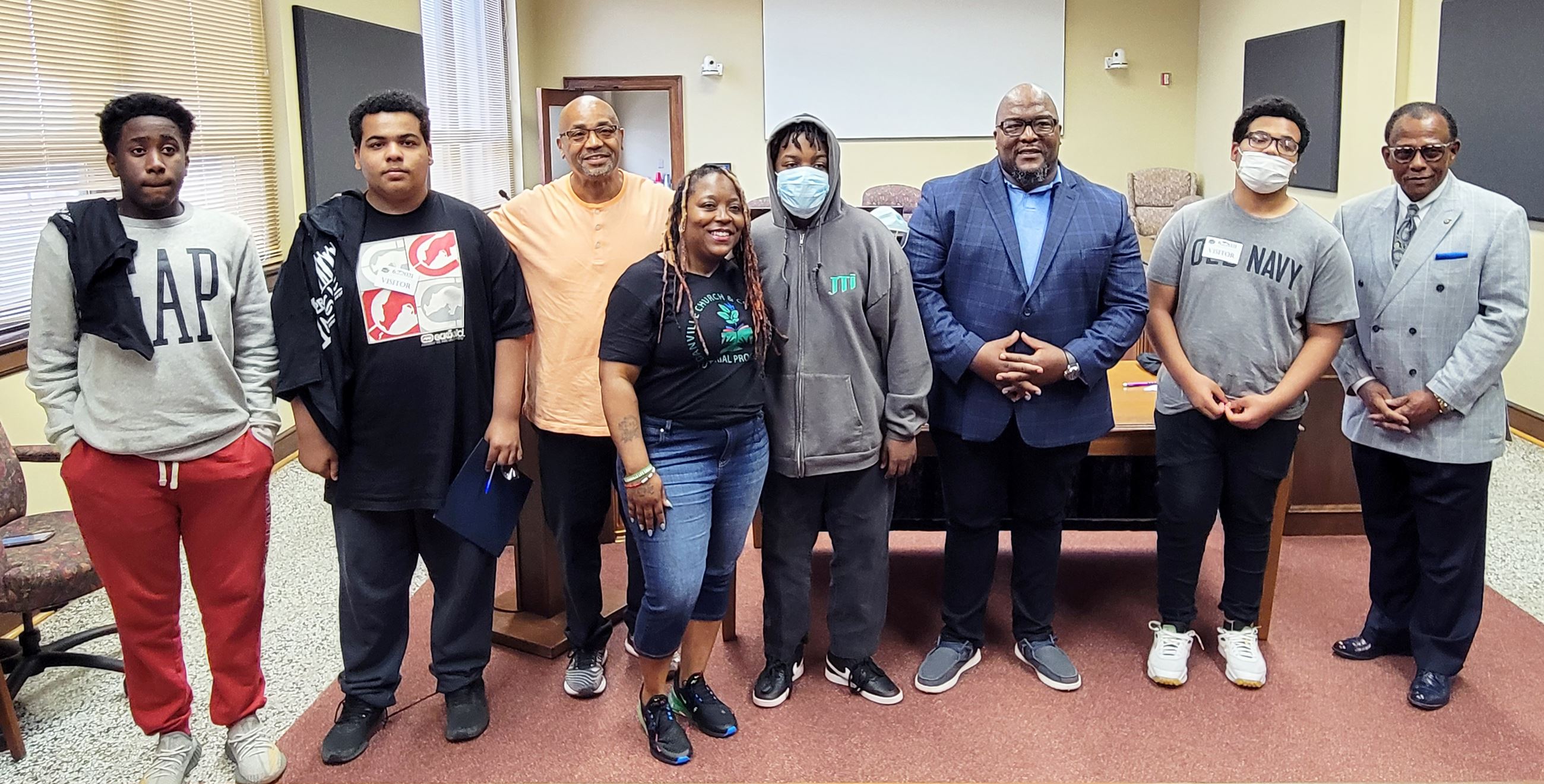 Group photo of five of the 10 teens honored
