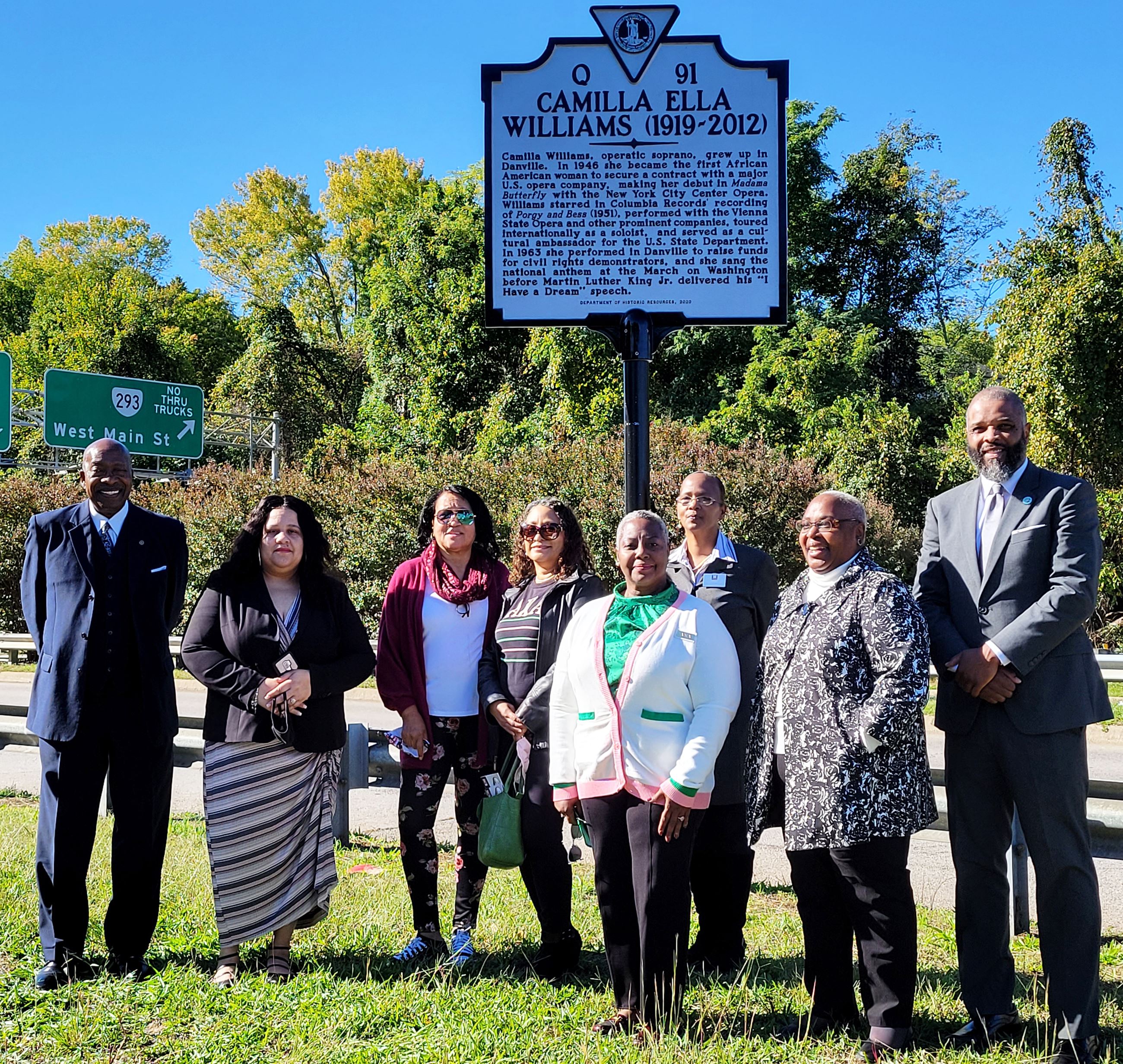 State and local officials pose at Camilla Williams marker