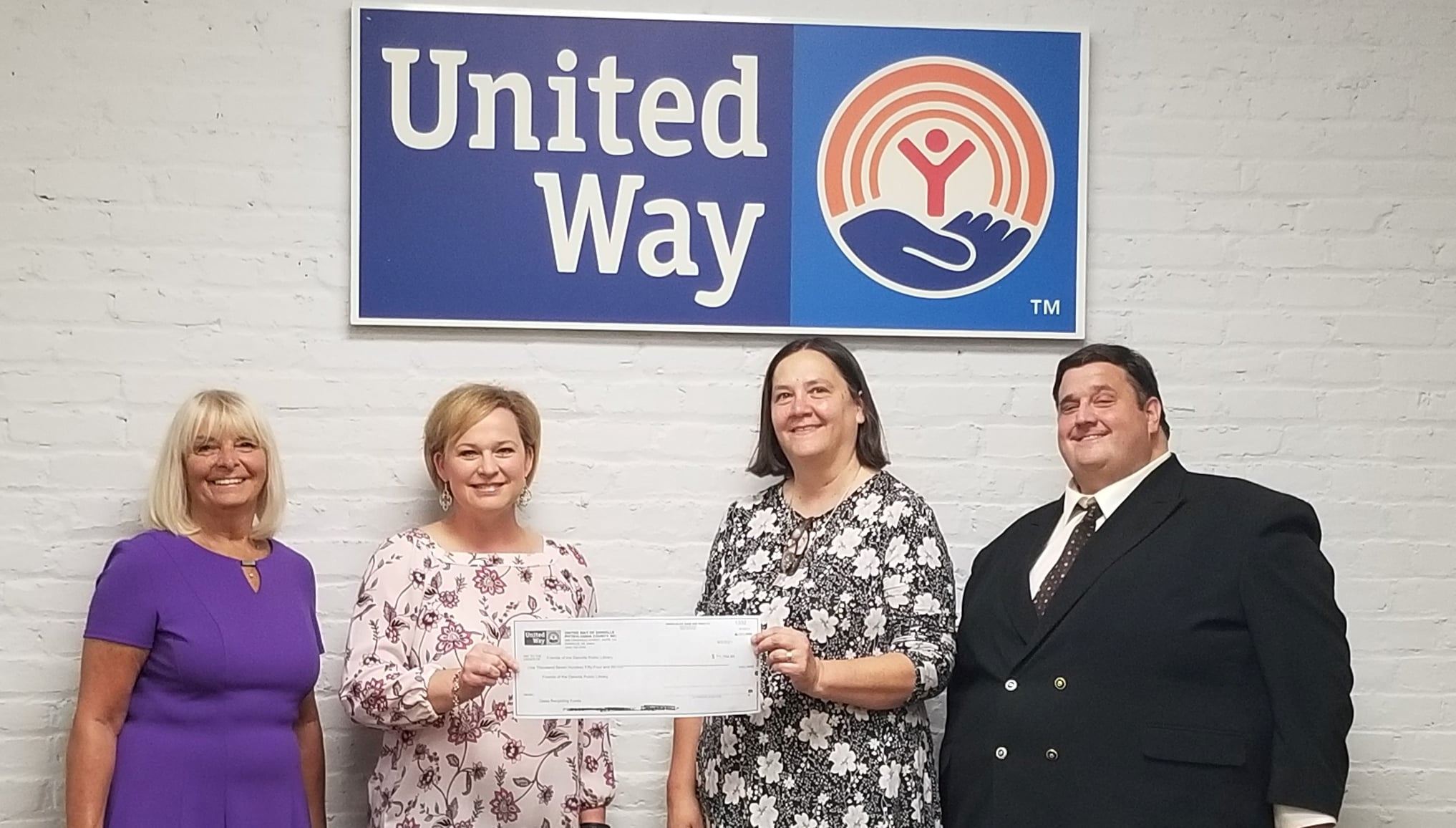 Book Ends receiving a check from the DP United Way