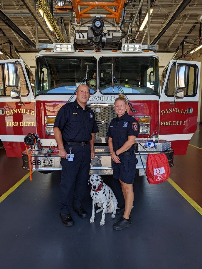 Chief Smith and Firefighter H. Alderson with Darla 