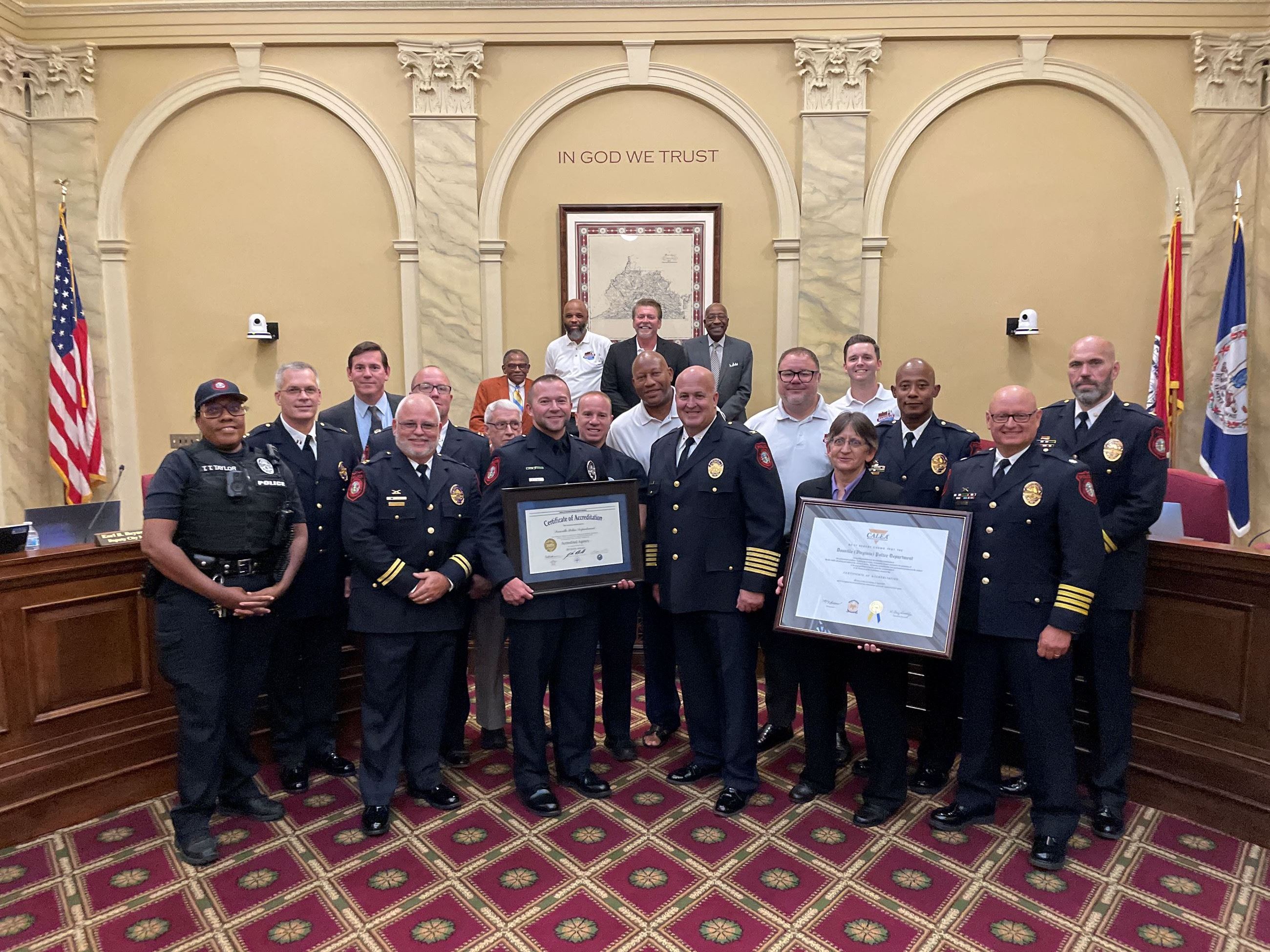 Re-accreditation group picture with police department members and city council. 