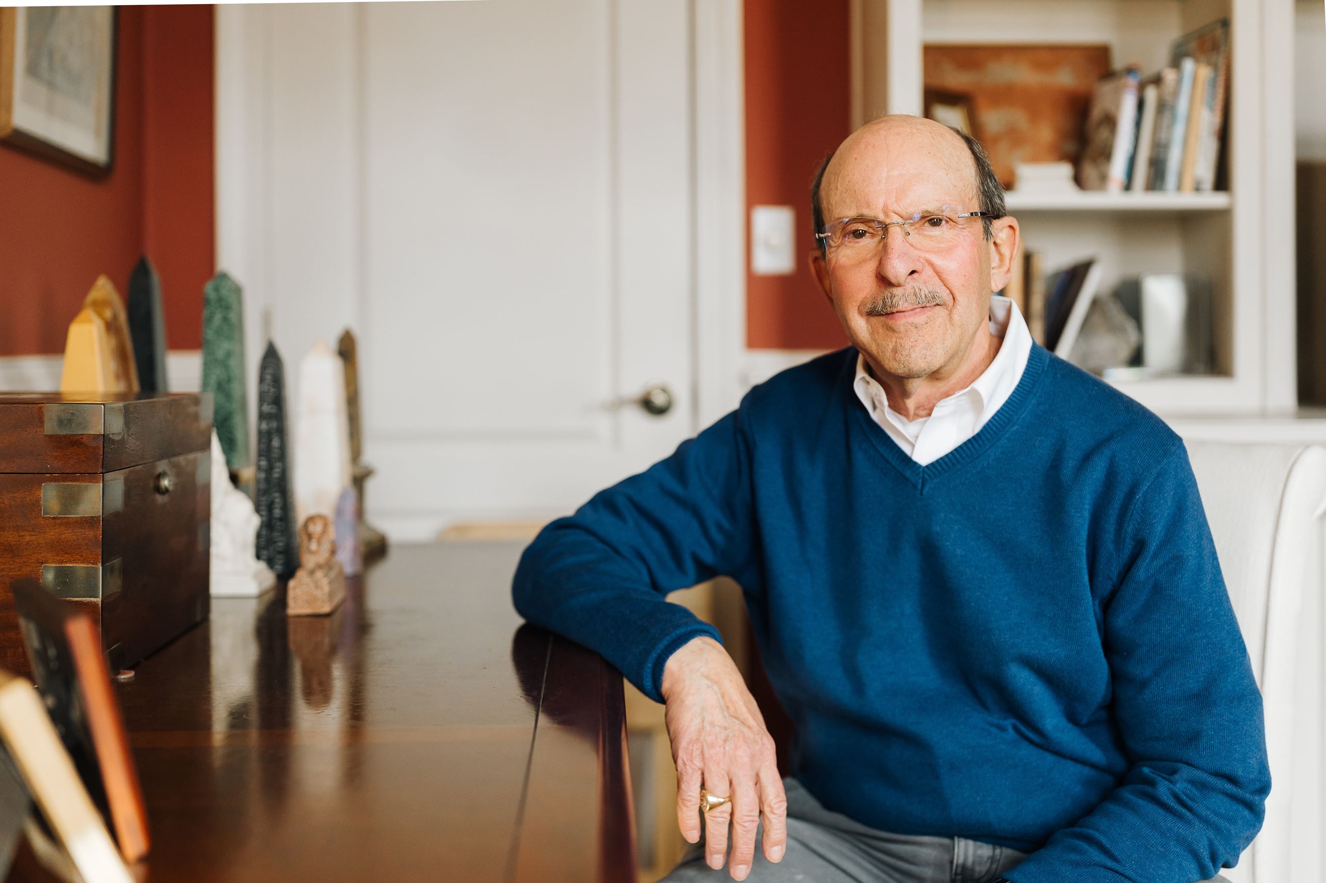 Samuel Kushner sitting in his home