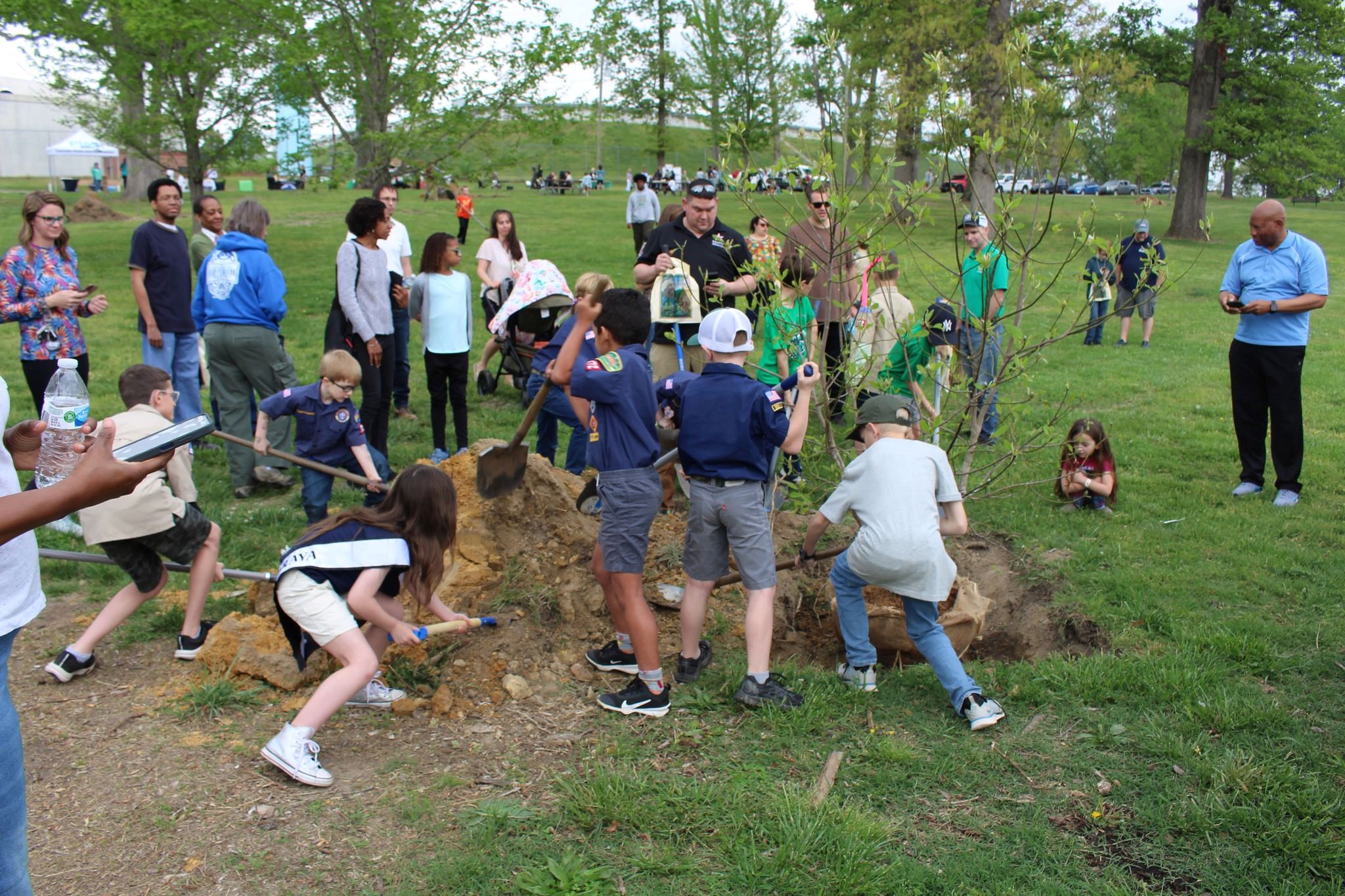 Students plant trees in Ballou Park.